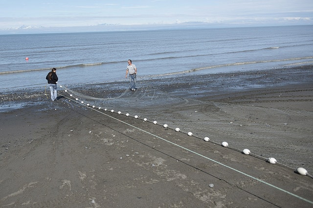 Julianne Wilson and George Showalter set the tribal net into Cook Inlet