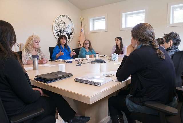 Kenaitze Chief Judge Kim Sweet, Executive Director Jaylene Peterson-Nyren, Executive Council Chairperson Rosalie A. Tepp and CASA Coordinator Thia Peters talk with visitors in the Keniatze Tribal Courtroom