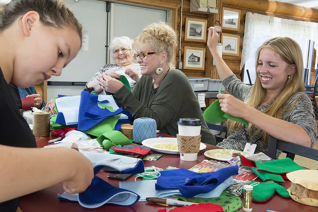 Nadia Walluk, Alexandra Lindgren, Kim Sweet, Shayna Franke crafting ornaments