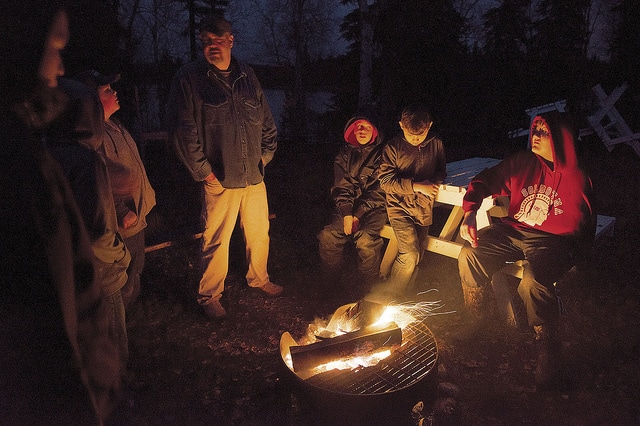 Participants in last fall’s Moose Camp gather around the fire