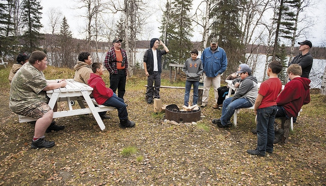 Participants in Yaghanen Moose Camp gathered and talking