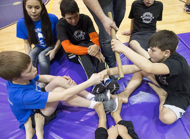 William Wilson and Seth Strange shake hands after competing in the Eskimo stick pull event