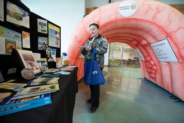 Wilma Omnik looks at educational materials at the Dena'ina Wellness Center's health fair