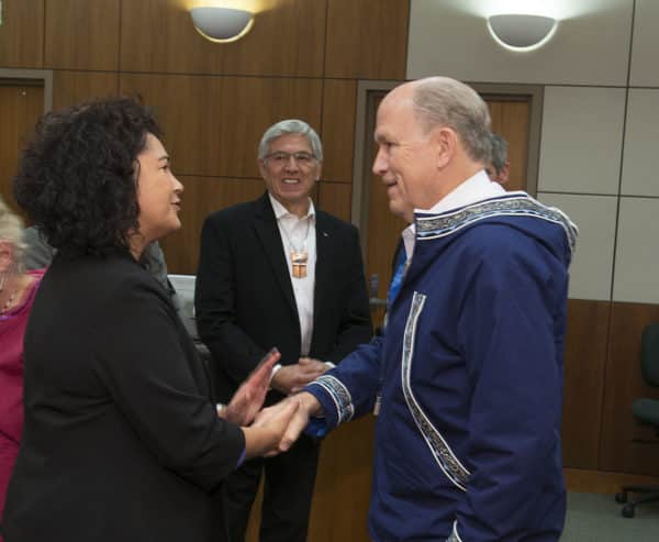 Kenaitze Executive Director Jaylene Peterson-Nyren shakes Gov. Bill Walker's hand following the ceremony. Lt. Gov. Byron Mallott, center, was also present as representatives of the tribe, state court and the Attorney General Office signed the agreement launching a new joint-jurisdiction wellness court for Kenai on Thursday afternoon at the Rabinowitz Courthouse in Fairbanks.