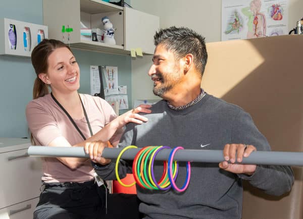 Occupational Therapist Sara Huot leads James Torkelson through a therapy appointment at the Dena'ina Wellness Center.