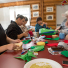 Youth and elders work together at Tyotkas Elder Center on Sept. 4, 2015, to create Christmas ornaments for the U. S. Capitol Christmas Tree.